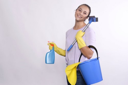 Staff handling cleaning chemicals with care